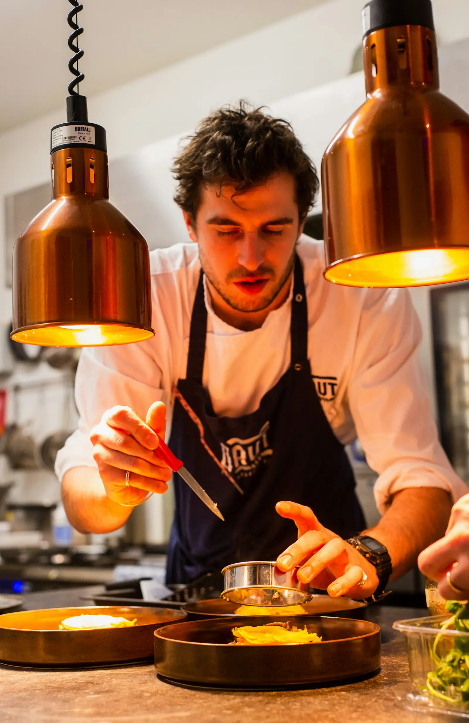 A chef plating a dish